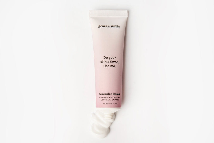 A tube of grace & stella lavender body lotion (473ml) free gift perfect for the skin, with some product squeezed out on a white background.